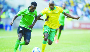 • ZAMBIA’S teenage midfielder, Lubambo Musonda (left) in a tussle with Thabo Matlaba of South Africa during last Sunday’s Africa Cup of Nations warm-up match at Orlando Stadium in Johannesburg. South Africa won 1-0.