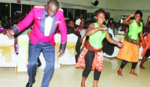 • Colonel Anthony Lupupa joins Green Buffaloes dancing queens on the dance floor during the Zambia Army annual ball on Wednesday. Picture By JEAN Mandela