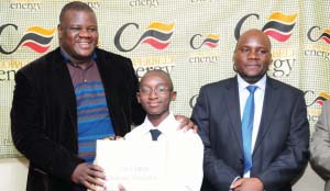 •THIRTEEN-YEAR-OLD Mulenga Chilambwe poses for a picture with Kitwe District Education Board secretary Kezala Mwale(left) and CEC managing director Owen Silwavwe.