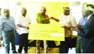 • L-R:Senior Chief Nzamane, MTN chief sales and distribution officer Amon Jere and Chief Madzimawe hold a dummy cheque when MTN Zambia officially donated towards Nc’wala ceremony. Picture By JULIUS PHIRI