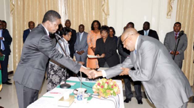 •PRESIDENT Edgar Lungu (left) congratulates Bank of Zambia governor Denny Kalyalya during the swearing-in ceremony at State House in Lusaka yesterday. Picture by CLEVER ZULU