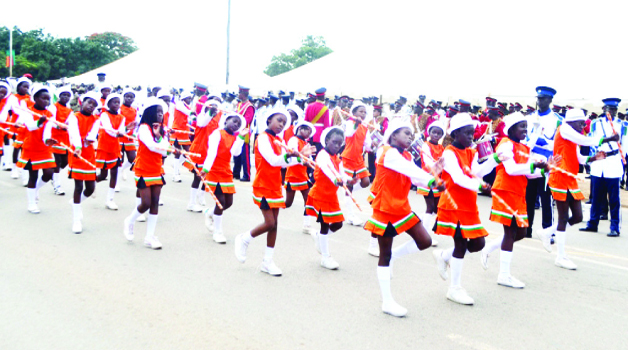 . MAJORETTES file past Acting President Ngosa Simbyakula (inset) at the Freedom statue during yesterday’s commemoration of Youth Day in Lusaka. Pictures by SAM PHIRI and EDDIE MWANALEZA