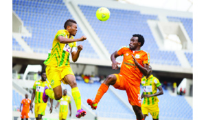 • ZESCO United striker, Winston Kalengo (right) in an aerial tussle with Guinea’s AS Kaloum captain, Ben Adamah during the CAF Champions League first round, first leg tie at Levy Mwanawasa Stadium in Ndola yesterday. The game ended in a 1-1 draw. Picture by KASUMPA KATAPA