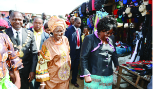 •VICE-President Inonge Wina (c) touring Chifundo Market in Mandevu yesterday with Tourism Minister Jean Kapata (r) and Lusaka Mayor George Nyendwa (l). Picture by ROYD SIBAJENE.