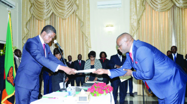 • PRESIDENT Edgar Lungu (left) receives an affidavit from Attorney General Likando Kalaluka during a swearing- in ceremony at State House in Lusaka yesterday. Picture by CLEVER ZULU