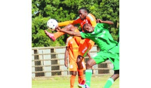 • ZESCO midfielder Justin Zulu (in orange) in a tussle with Buffaloes’ Bushizya Mfune during yesterday’s MTN-FAZ super league rescheduled Week One match at Woodlands Stadium in Lusaka. Picture by JEAN MANDELA