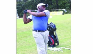 • LOCAL professional Bube Samutela tees off from Number One during yesterday’s opening round at the Mopani Copper Mines/Redpath Mining Zambia Open Championship at Nkana Golf Club in Kitwe. Picture by SYDNEY KALUNGA