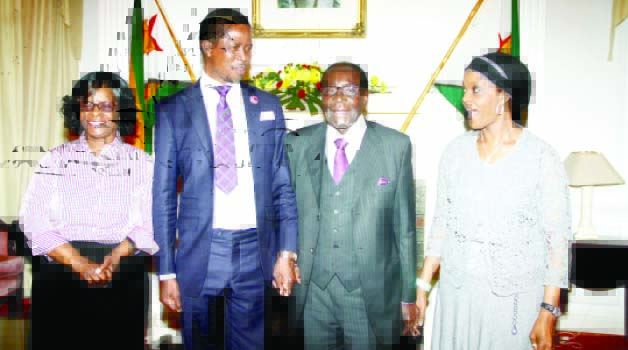 • President Lungu, (second left) and First Lady Esther with Zimbabwe’s President Robert Mugabe and his wife Grace shortly before a closed door meeting at State House in Harare yesterday. Picture by THOMAS NSAMA