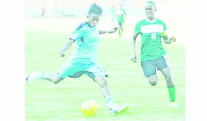 • SHEPOLOPOLO captain, Meya Banda (right) tries to block Mwanahamisi Shurua of Tanzania during the 2015 All-Africa Games qualifier at the National Stadium in Dar-es-Salaam on Friday. Zambia won 3-2 but bowed out on a 5-6 aggregate. Picture by DAILY NEWS TANZANIA.