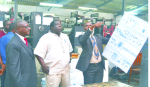 • TIMES Printpak production manager Joseph Phiri (right) explains the newspaper production process to Information and Broadcasting Services Minister Chishimba Kambwili (middle), as company deputy managing director Chishimba Chishimba looks on. This was during the minister’s visit to the Times head office in Ndola yesterday. Picture by MOSES CHIMFWEMBE