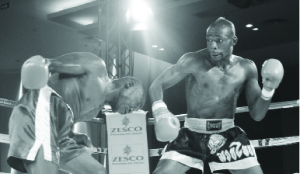 • GOING FOR A KILL...BABEGUY Chimanga (right) prepares to unleash a punch on Zimbabwean boxer Admos Takavira during a middleweight non-title fight at Government Complex on Friday night. Picture by CHRISTINE MWAABA.