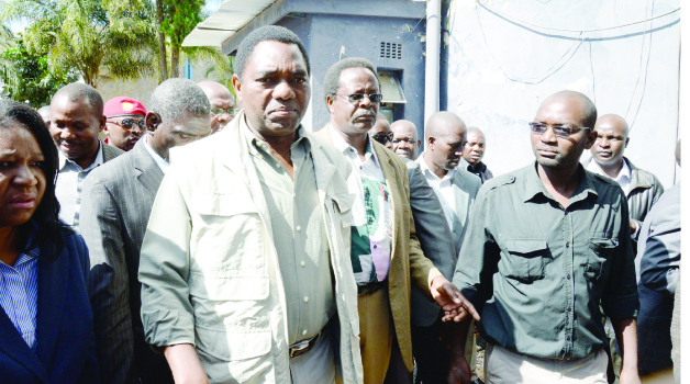 • UNITED Party for National Development (UPND) leader Hakainde Hichilema (left) arrives at Kabwata Police, where he was summoned for questioning yesterday.