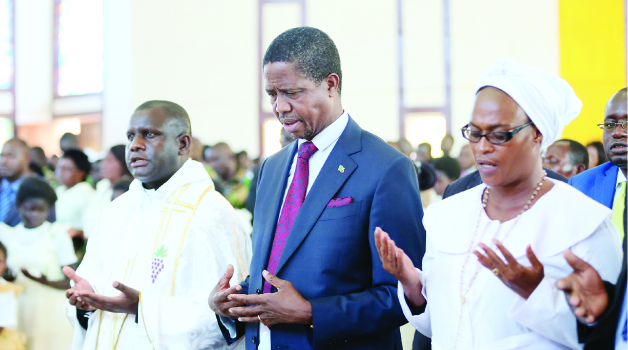 • PRESIDENT Edgar Lungu joins parishioners in prayer during a church service at Saint Daniels Parish in Solwezi yesterday. Picture By Eddie Mwanaleza