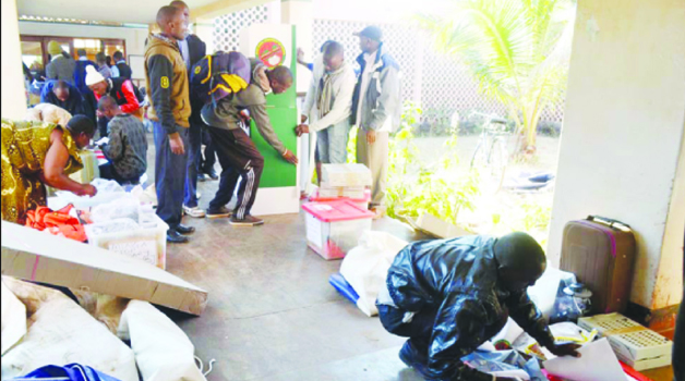 •ELECTORAL Commission of Zambia officials sort out election material in readiness for the by-election for Petauke Central Constituency in Eastern Province. Picture by CHUSA SICHONE