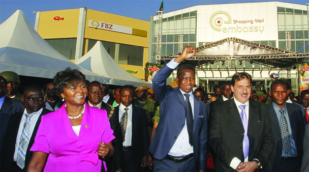 • President Edgar Lungu (centre) flanked by Commerce Trade and Industry Minister Margaret Mwanakatwe (left) and Clicks Zambia Limited director Aki Vasilakopoulos after the official opening of Embassy Shopping Mall in Chawama in Lusaka yesterday. Picture By SALIM HENRY