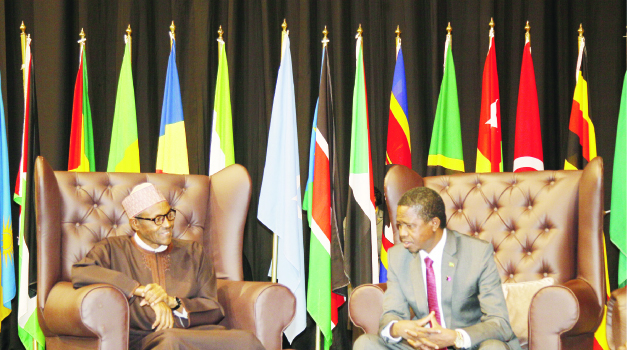 • PRESIDENT Edgar Lungu (right) talks to his Nigerian counterpart General Muhammadu Buhari (left) at Sandton Convention Centre in Johannesburg, South Africa. Picture by SALIM HENRY