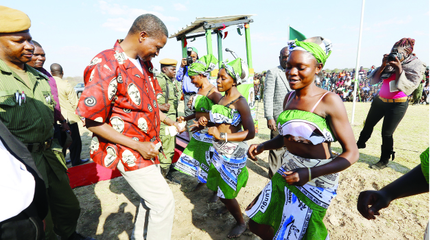 PRESIDENT Edgar Lungu dances with members of the Mombochima DanceTroupe of Mongu in Mulobezi Constituency yesterday. Picture By EDDIE MWANALEZA/STATE HOUSE