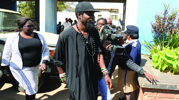 • MUSICIAN Chama Fumba, alias Pilato, arriving at Lusaka Central Police yesterday. Picture by CLEVER ZULU