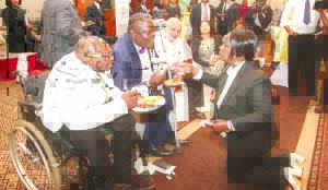 •FIRST Lady Esther Lungu (Kneeling) serves some of the persons living with disabilities during the launch of the Education Outreach for Children with Disabilities in Lusaka yesterday. Picture by THOMAS NSAMA