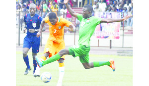 •A Zambia Under-23 player (right) in a tussle against an Ivorian in the first leg of the CAF Under-23 Championship in Abidjan.