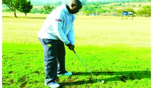 •MPUMALANGA Black Aces’ Zambia striker, Collins Mbesuma lines up a golf tee shot after taking a break from the South African football club’s pre-season training.