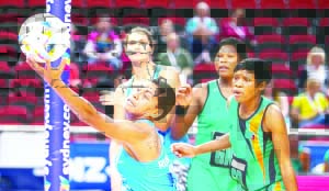 •FIJI attacker Unouna Afa Rusivakula tries to control the ball as Zambia defender Margret Mutafela (right) and Agness Chingambo keep guard during yesterday’s Sydney 2015 Netball World Championship preliminary round tie. Fiji won 59-51.