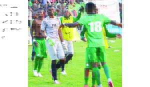 •ZAMBIA Under-23 players led by skipper Toaster Nsabata (centre) and Patson Daka (jersey 18 back to camera) celebrate qualification to the Senegal 2015 Africa Under-23 Championship at Nkoloma Stadium in Lusaka yesterday. Picture by GWEN CHIPASULA