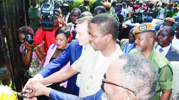 • PRESIDENT Edgar Lungu (c) cuts the ribbon along with chairperson of the board Adam Taylor (l) and director of Yalelo Zambian Fish, Fisho Mwale in Siavonga yesterday. Picture by ROYD SIBAJENE/ZANIS