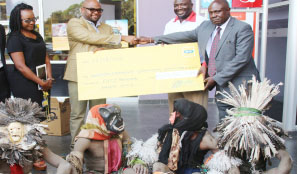 •FROM left to right: MTN consumer sales regional manager Catherine Simukonda, MTN chief sales and distribution officer Amon Jere, Chewa people Kulamba traditional ceremony organising committee deputy treasurer Masiye Banda and national treasurer Gibson Phiri receiving a cheque worth K50,000 at the MTN head office in Lusaka towards the hosting of the Kalumba traditional ceremony to be held this weekend. Picture by JEAN MANDELA