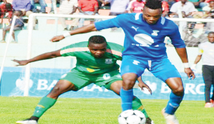 •ZESCO United defender Simon Silwimba (left) keeps a close eye on Kabwe Warriors striker Idris Mbombo during Sunday’s Barclays Cup quarter-final match at Nkoloma Stadium in Lusaka. Zesco won 2-0. Picture by ZESCO UNITED FC
