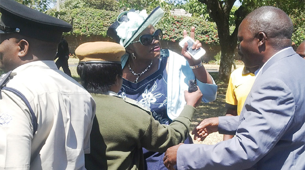 •CHONGWE Member of Parliament Sylvia Masebo gestures to police officers at Woodlands Police Station in Lusaka yesterday. Picture by CHUSA SICHONE