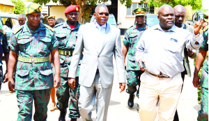 • SOUTHERN Province Rural Roads Unit provincial engineer Edward Ntinda (r) takes Defence deputy minister Christopher Mulenga (in suit) and ZNS Unit Choma commanding officer Lieutenant-Colonel Jimmy Kafumukache (left) on tour of RRU offices in Choma. Picture by CHILA NAMAIKO