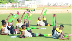 • CHIPOLOPOLO players loosening up during a training session at the Olympic Youth Development Centre in Lusaka. Picture by SANDRA MWILA