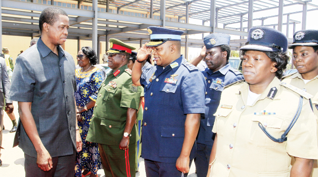 • President Edgar Lungu (left) being saluted by service chiefs at City Airport before departure for Luapula Province yesterday. Picture By SALIM HENRY/STATE HOUSE