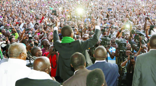 • PRESIDENT Edgar Lungu acknowledges the multitudes that gathered for the prayers at the Lusaka Show grounds.