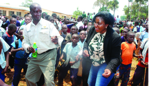 •KALUMBILA Minerals Limited public relations coordinator, Mirriam Harmon (right) and Trident Foundation community relations coordinator, Alex Mapapayi immersed in dance after the official hand-over of educational infrastructure to Kisasa Primary School in Kalumbila District on Friday.- Picture by MARTIN MUSUNKA