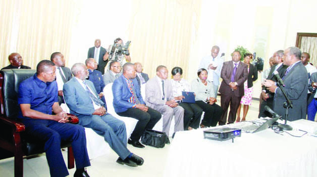 •PRESIDENT Edgar Lungu (left) listens to the Government Mining Technical Audit Committee chairperson Sixtus Mulenga during the hand-over of the report on the technical findings involving mines on the Copperbelt and North-Western provinces at State House yesterday. Picture by THOMAS NSAMA/STATE HOUSE