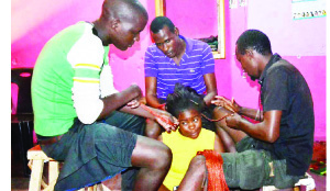 •MASAI hairstylists attending to a customer on Katondo Street in Lusaka on Friday. 
