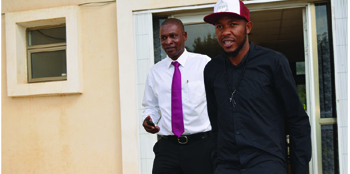 •DEFENDER Christopher Munthali (right) with Players Union chairman Linos Chalwe leaves Football House after being slapped with two-month ban yesterday Picture By GWEN CHIPASULA.