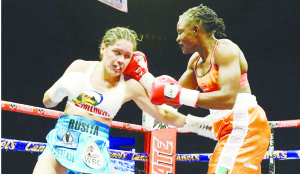 •World Boxing Council (WBC) bantamweight gold champion Catherine Phiri of Zambia (right) lands a right punch to the head of Yazmin Rivas of Mexico at Convention Centre Rosarito in Baja California. Picture By fightnews.com.