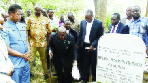 • PRESIDENT Edgar Lungu (left) and Dr Kenneth Kaunda (third from left) visit the burial site of the first Republican president’s mother, Helen Nyamunyirenda, in Lubwa, Chinsali, yesterday. Picture by SALIM HENRY/STATE HOUSE