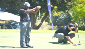 • Muthiya weighs up his shot before going for a putt on the ninth hole during yesterday’s opening round of the 2016 Zambia Sugar golf Open at the Lusaka golf club. (Right) South African Merrck Brenmer tees up before birding. Picture by GWEN CHIPASULA