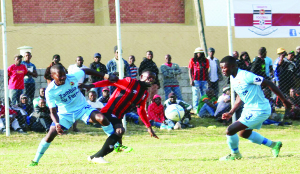 • YOU ARE NOT GOING ANYWHERE: Red Arrows defender Roderick Zimba tackles Zanaco forward Augustine Mulenga from behind as Red Arrows captain Jimmy Chisenga charges in from the front. This was in an MTN-FAZ Week 13 Super League game at Sunset Stadium in Lusaka. Zanaco won 2-0. Picture courtesy of ALLAN MATIYA