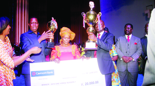 •President Lungu (second left), First Lady Esther (centre) with Busokololo choir director Kombe Mpundu (second right) and Bread of Life Church International overseer Joe Imakando (right) after the Busokololo choir scooped the ZNBC One Voice Grand Finale singing Competition at Bread of Life Church, Blessings Centre yesterday -Picture by THOMAS NSAMA
