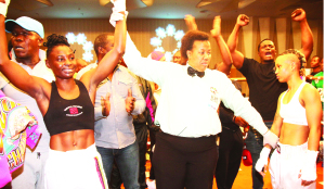 •REFEREE Silvia Mokaila (centre) declares holder Catherine Phiri (left) winner of the World Boxing Council gold bantamweight title fight in Lusaka on Saturday night as her beaten South African challenger, Gibisile Tshabalala looks on. Picture by JEAN MANDELA