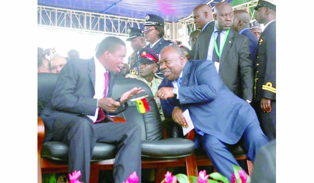 •President Edgar Lungu chatting with Gabonese President Ali Bongo (right) during the inauguration ceremony of Ghanaian President Nana Addo Akurfo at Black Star Stadium in Ghana yesterday Picture by SUNDAY BWALYA/ZANIS