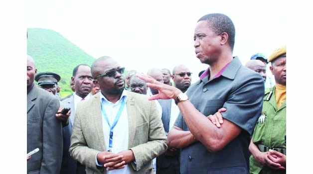 • PRESIDENT Edgar Lungu (right) speaks to Eastern Province Water and Sanitation Company managing director Lytone Kanowa when he toured Katete Dam in Katete yesterday. Picture by STEPHEN MUKOBEKO/ZANIS