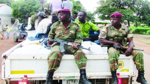 SPECIAL Forces from the 48 Marine Unit in Nchelenge District accompany a truck laden with bags of mealie meal after intercepting the merchandise on Lake Mweru, enroute to the Democratic Republic of Congo in a suspected case of smuggling. Picture By CHILA NAMAIKO