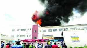 •THICK black fumes, as Bible House on Lusaka’s Freedom Way catches fire, attracting curious onlookers yesterday.Picture by CHUSA SICHONE