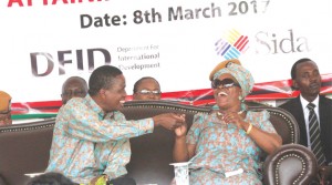 •PRESIDENT Edgar Lungu jokes with First Lady Esther, when Young Women Christian Association chairperson Posile Sichinga (not in picture) told husbands during yesterday's International Women’s Day celebrations in Lusaka to show love to their wives. Picture by JEAN MANDELA